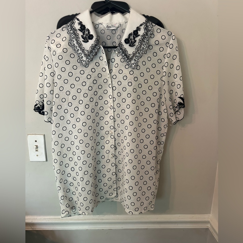 Black and white blouse with circle print.